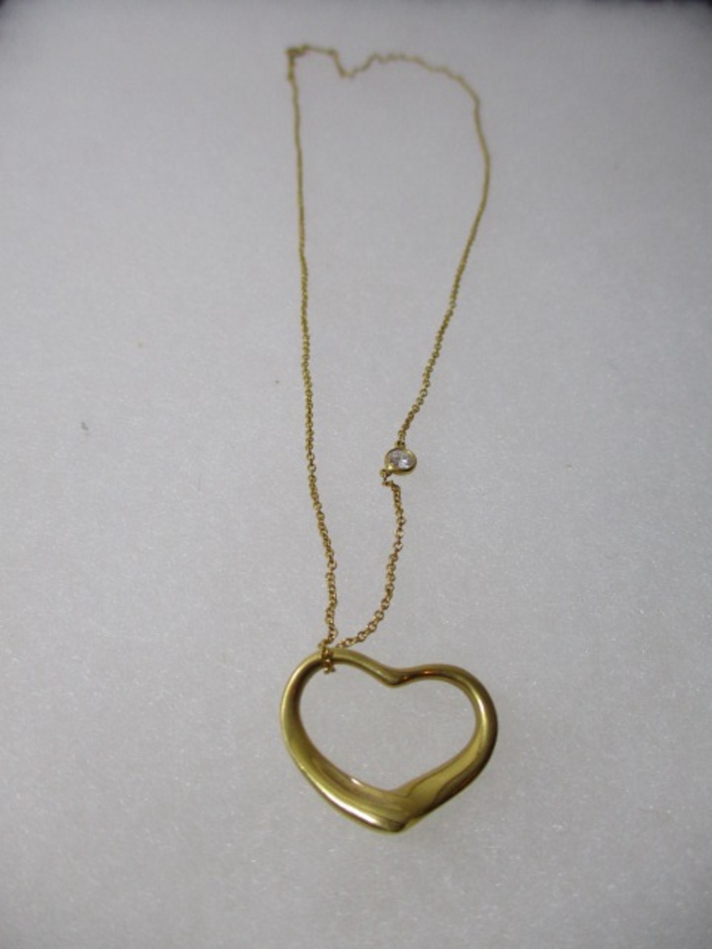 Tiffany & Co. Yellow Gold Heart Outline Pendant Necklace with bezel diamond